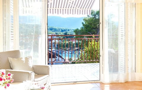 beautiful living room with view onto the sea, yachts and pine forrest