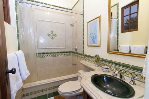 Private bathroom with colonial Antigua tiles.