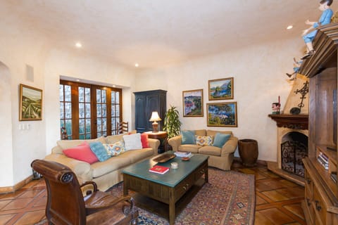 Cozy family room off the kitchen with 48" TV, fireplace and comfortable seating.