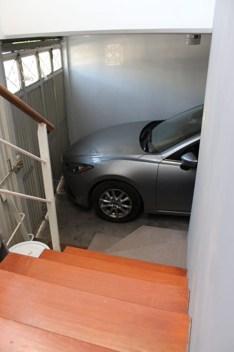 Covered garage for small cars, fits Corolla and Mazda3 type.