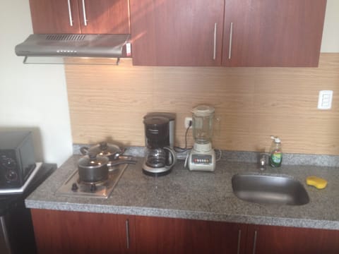 Fridge, microwave, stovetop, coffee/tea maker