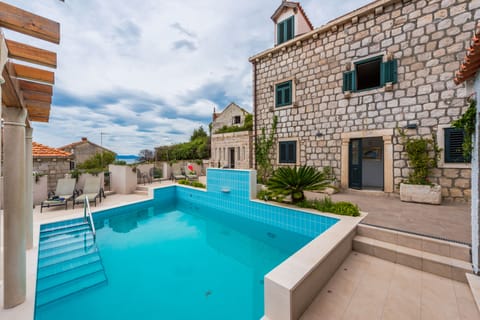 A heated pool, sun loungers