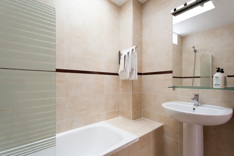 Combined shower/tub, hair dryer, towels, soap