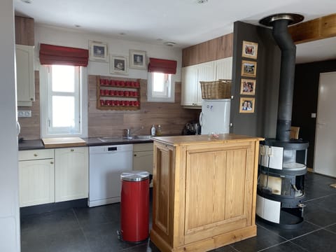 Refrigerator with freezer, Nespresso coffee machine, regular coffee machine.