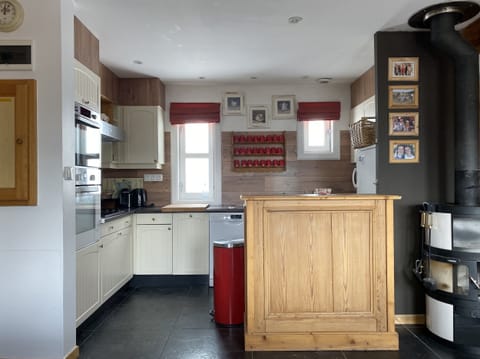 Kitchen with all appliances and utensils.