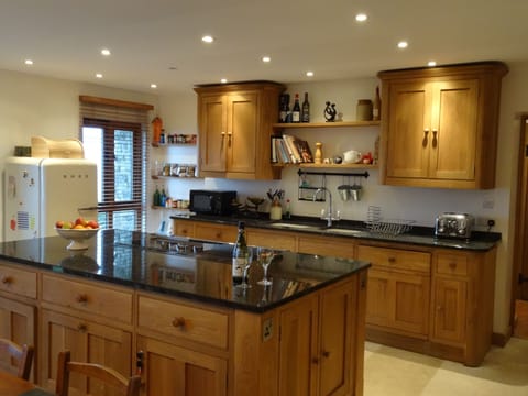 Oak kitchen with granite worktops