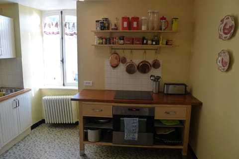 Oven and cooktop.  The kitchen also contains a dishwasher.