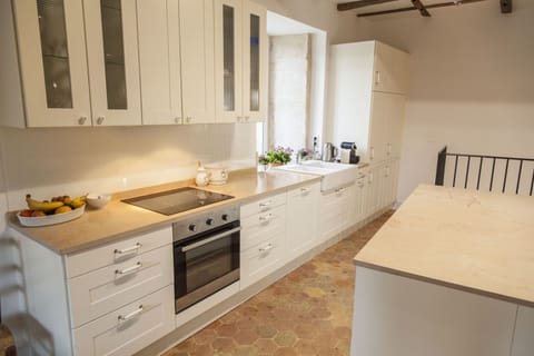 1st floor opens to generous kitchen, dining & living areas.