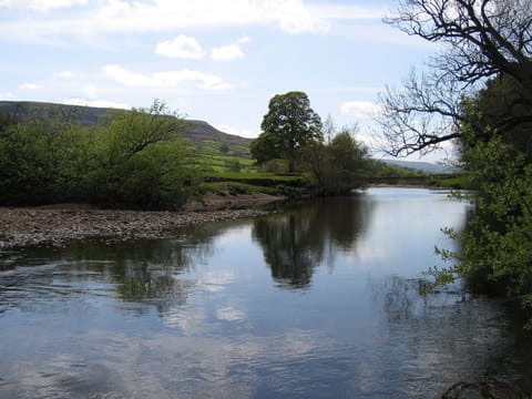 Our River boundary with seats by the water edge, sit, paddle or swim