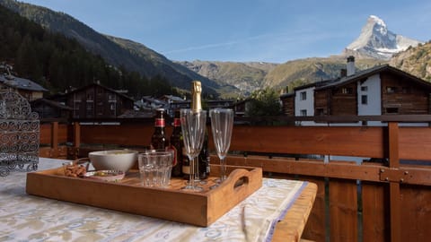 Enjoy the evening sun setting behind the Matterhorn from your balcony