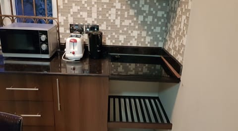 Microwave, coffee/tea maker, cookware/dishes/utensils