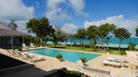 A heated pool, sun loungers