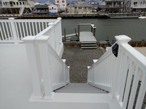 Rear stairway to yard and dock
