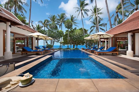 An infinity pool, sun loungers