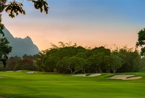 Mesmerizing view of Bali Hai and lush fairways from the lanai at sunset — the ideal evening backdrop.