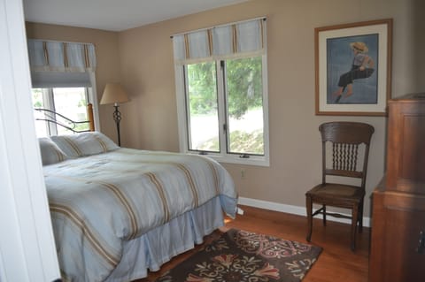 Queen bedroom, windows bring wonderful light and also offer darkening shades.