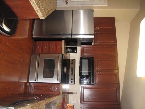 Microwave, dishwasher, coffee/tea maker, cookware/dishes/utensils