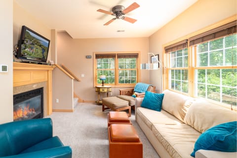 Relax in our bright and cheery living room or the fireplace for a cozy evening. 