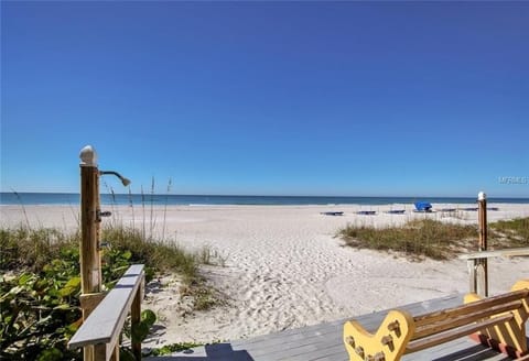 On the beach, sun loungers, beach towels