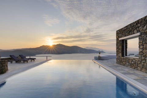 Outdoor pool, an infinity pool, sun loungers