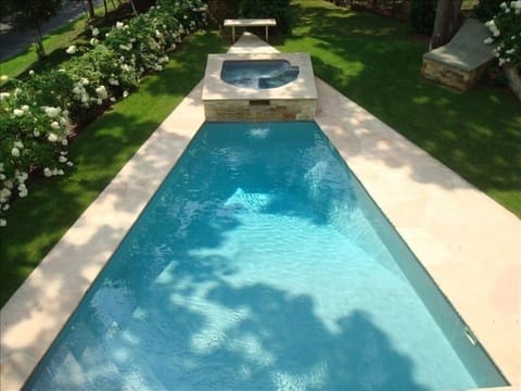 Custom Pool with Waterfall Spa and Stone patio