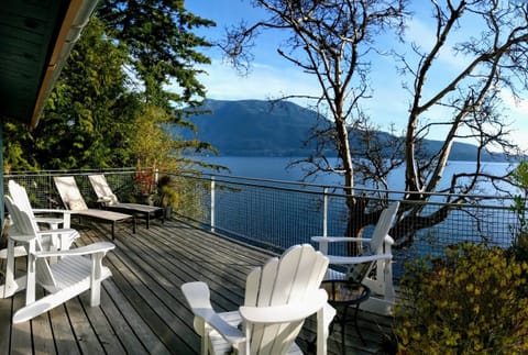 Expansive Waterfront Decks with lounge seating, dining & BBQ