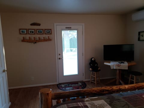 Cabin room showing door to outside deck.