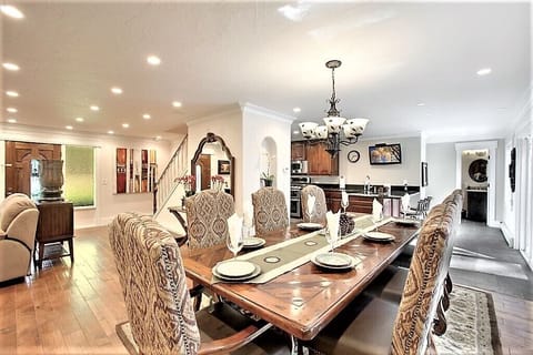Great Room A Large customer designed Dinning table for 12. Addition chair inside Garage