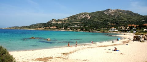 On the beach, sun loungers