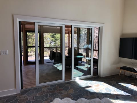 Panoramic doors leading to screen porch