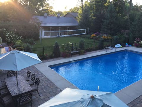 Backyard Pool area, patio and volleyball court 
