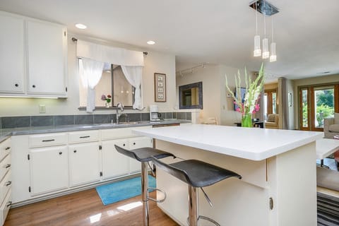 Open kitchen with all modern conveniences, new appliances, fully stocked.