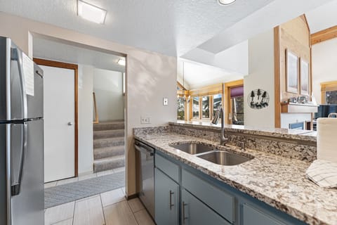 Updated full-size kitchen with stainless steel appliances and granite countertops.
