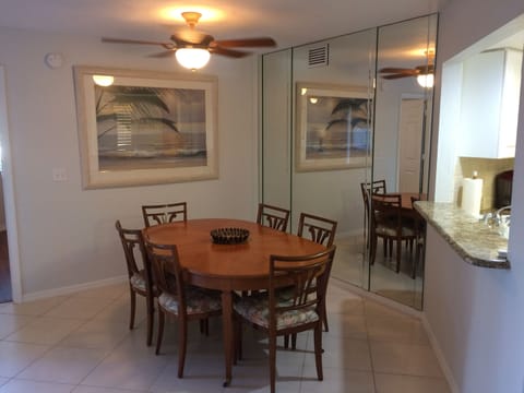 Dining area seats 6 comfortably. Large painting of beach scene