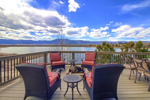 Deck overlooking Woodmoor Lake with gas fire pit.