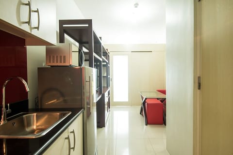 Fridge, microwave, electric kettle, dining tables