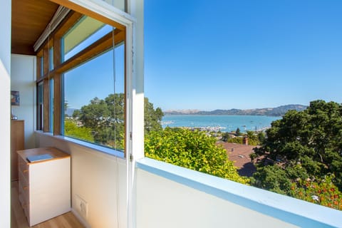 Small deck bay view and doorway into twin room