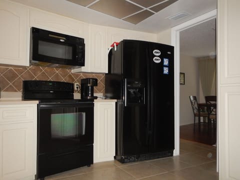 Kitchen with lage food center and ice maker