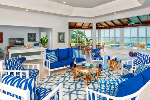 Spacious open living/dining/TV areas fronted by Caribbean Sea