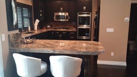 kitchen with counter level bar stools