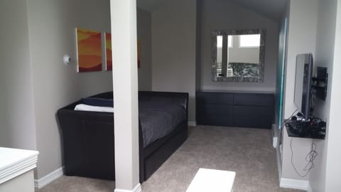 Guest bedroom #4 upper loft room, TV,  sitting area and includes full bathroom.