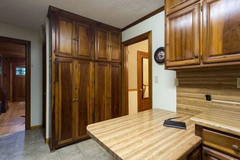 There are cabinets for plenty of food storage. You can see the home`s entry door from this location