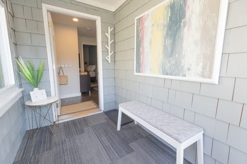 Inviting sun porch with motion sensor light; helpful for those night arrivals.