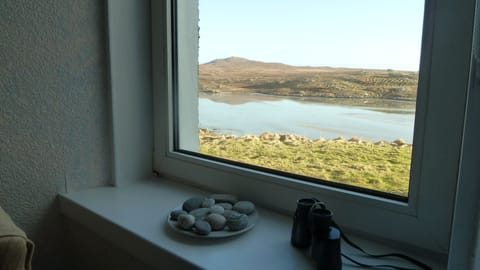 Living Room window, looking east. Tide in on beach below