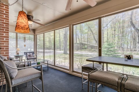 Delightful ~200 sq. ft. screened porch offers dining and relaxed seating options