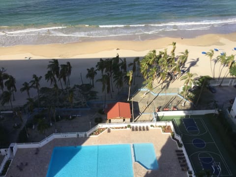 On the beach, sun loungers, beach towels