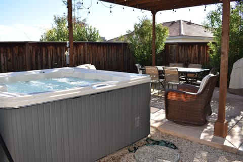 Backyard w/ hot tub, dining, BBQ, arm chairs and gazebo to relax, chill & wine:)