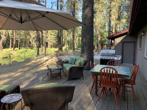 Sit or dine on the back deck overlooking the river.