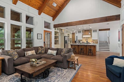 Stunning wood floors and a bright, airy living room create an inviting atmosphere in this beautiful space.