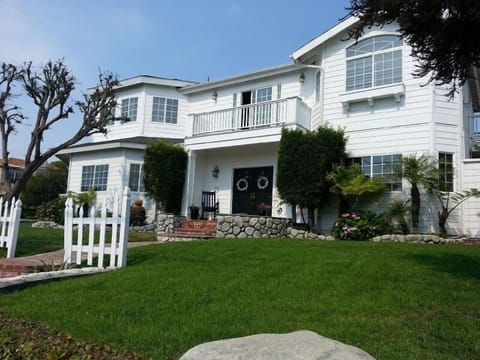 Front View with sprawling yard on corner lot. Plenty of running around area